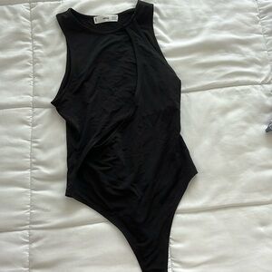 Mango bodysuit with a cutout. Never worn.